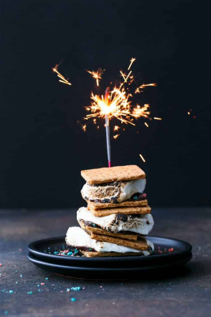 crispy graham crackers, melty chocolate, charred marshmallows and add popping candy.