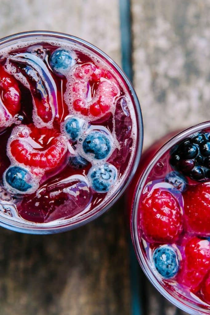Blueberries, raspberries, and blackberries have this sangria screaming summer! Load it up with ice, top with some chilled club soda, and it's lovely on a hot summer day — or skip the ice and sip it as is on a cool summer's evening. Either way, you'll be glad you did.