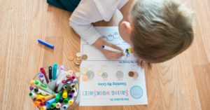 Fun FREE Saving Worksheet! These are great tips to teach your young child about money. I love the idea of using spare change for allowances, money identification, and saving habits. It's important to start teaching good money habits early and this post has some fun ways to do it! Check it out!